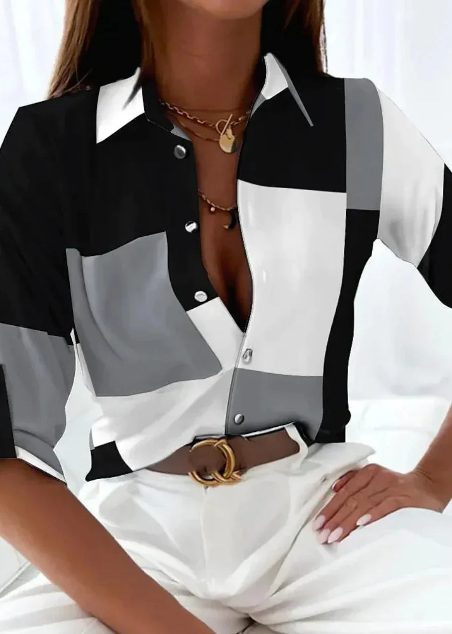 Flowy women's printed blouse, comfortable and versatile for workwear or elegant casual outfits.