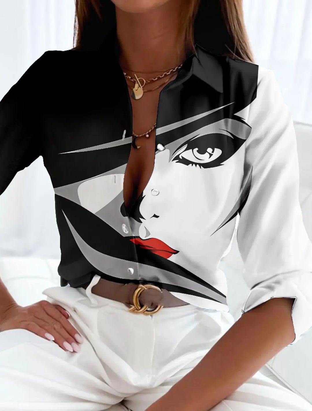 Stylish women's printed blouse featuring a unique contemporary pattern and relaxed fit. Ideal for a chic look.