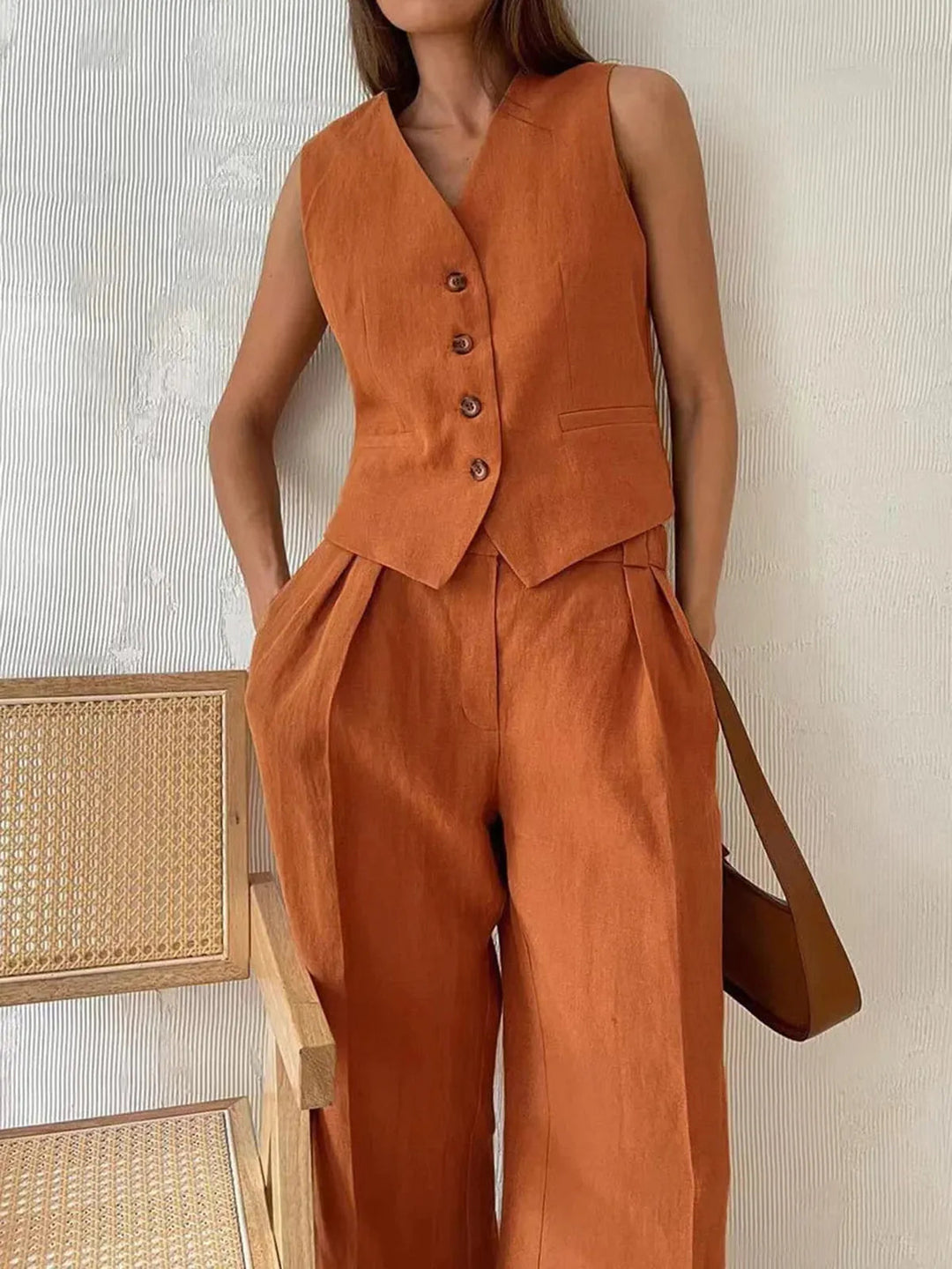 Effortless women's relaxed fit cotton linen two-piece set, featuring a stylish waistcoat & wide-leg pants.