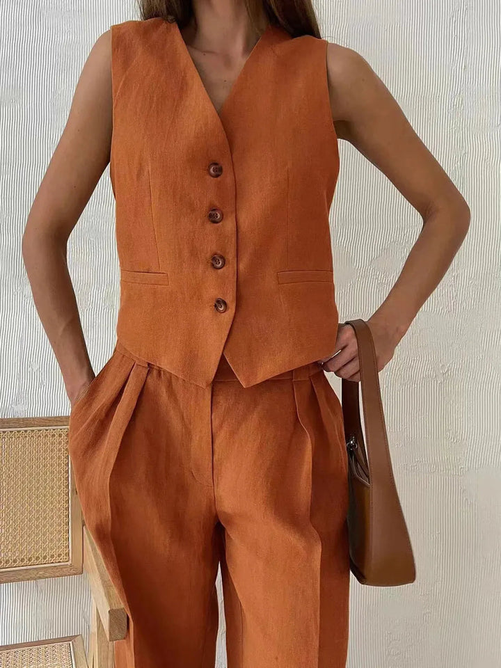 Complete women's cotton linen pants set, including a relaxed waistcoat & wide-leg trousers for summer elegance.