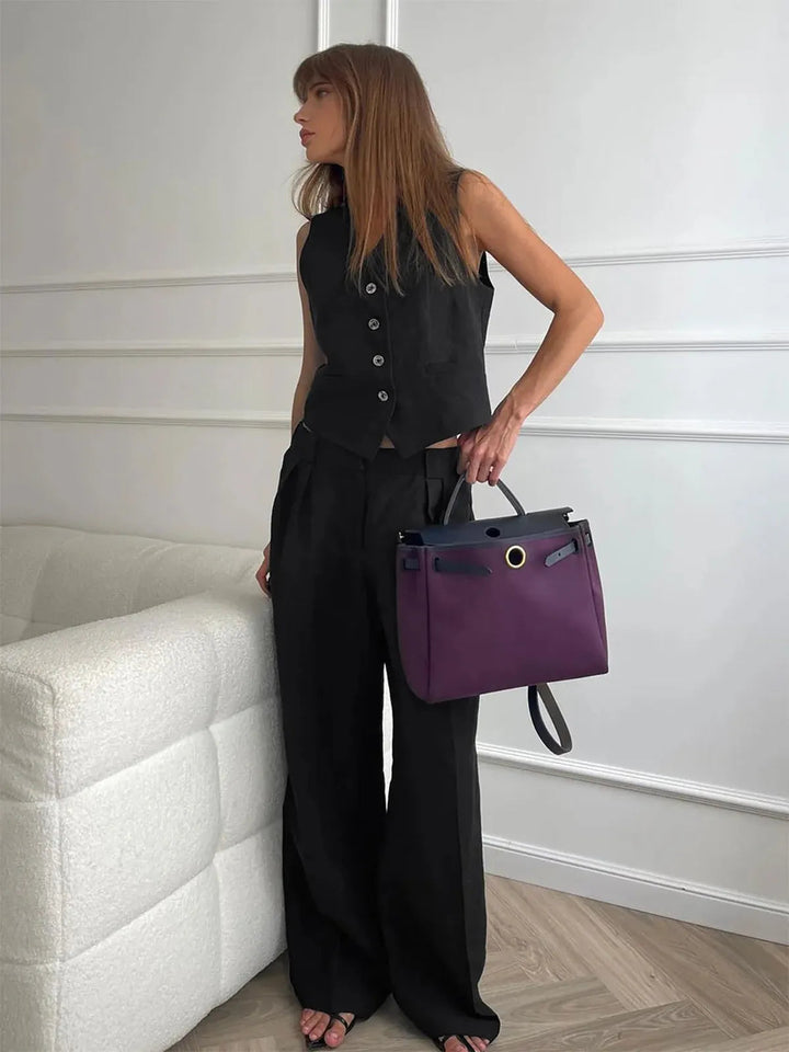 Casual women's cotton linen two-piece set with a stylish waistcoat and comfortable wide-leg pants for warm days.