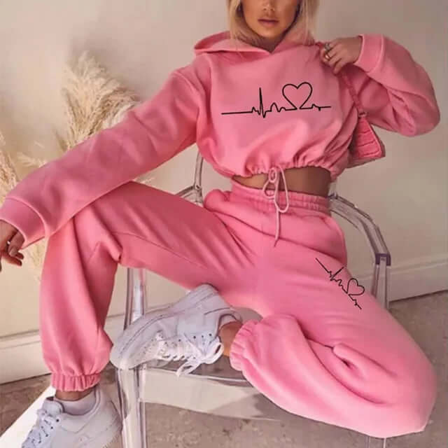 Versatile women's jogging suit: a cozy hoodie and sleek leggings, ideal for fitness, loungewear, or errands.