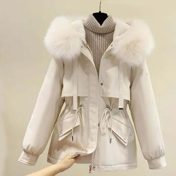 Soft knitted beige two-piece lounge set for women, featuring a cozy hoodie and relaxed fit for ultimate comfort.
