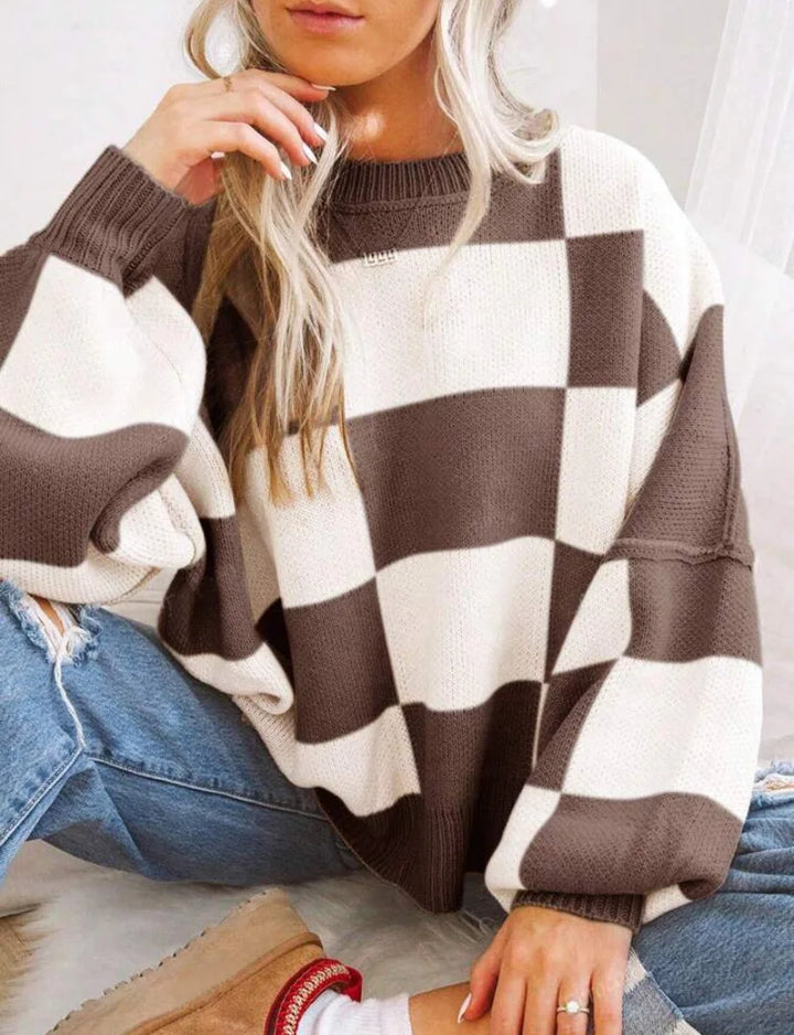 Fashionable women's checkerboard sweater. A cozy, relaxed top for trendy fall wear.