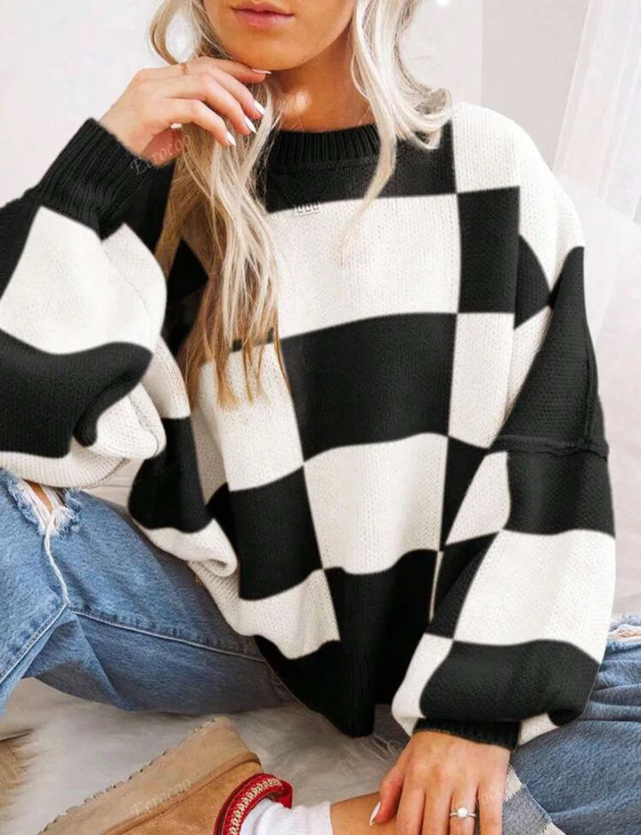 Statement women's checkerboard sweater. Cozy, relaxed fit for stylish fall apparel.