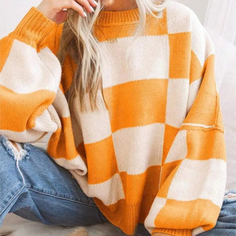Women's oversized checkerboard sweater. Trendy and warm for fall & winter apparel.