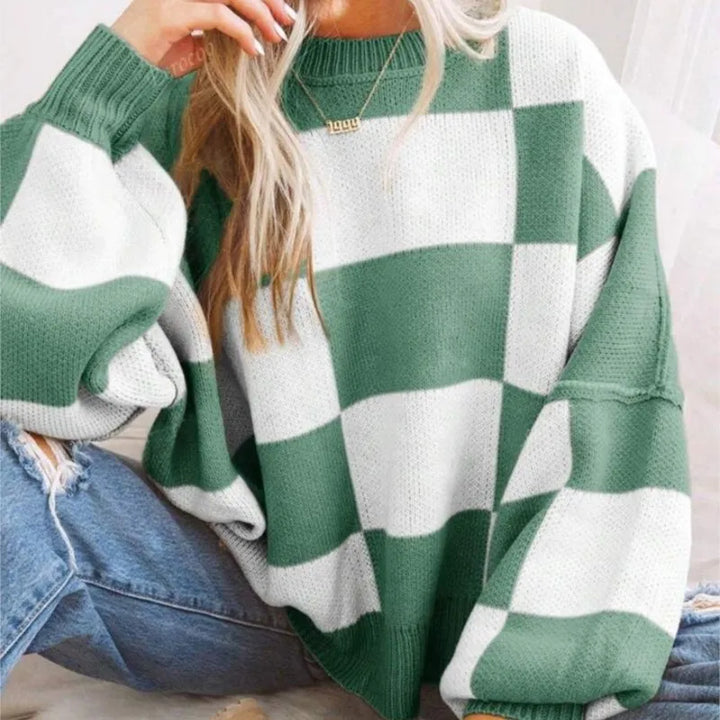 Relaxed fit women's checkerboard sweater. Soft and stylish for everyday casual wear.