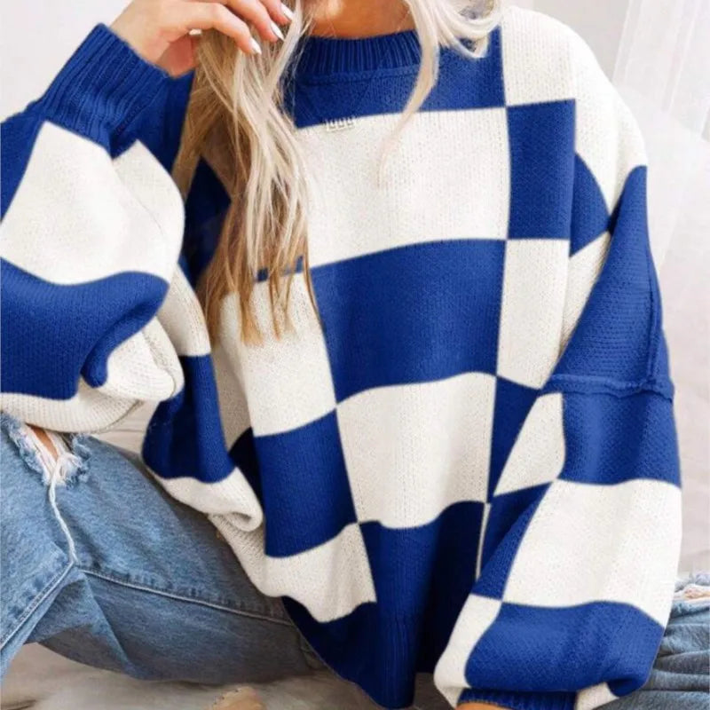 Classic checkerboard pattern women's sweater. Cozy, stylish fall fashion essential.