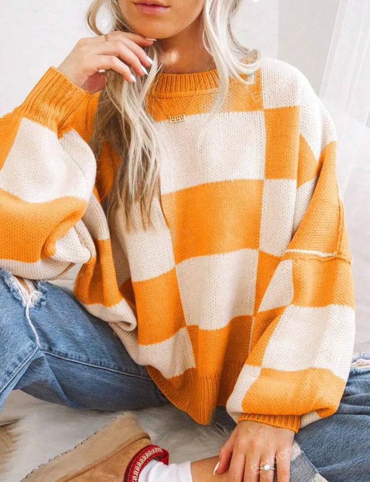 Women's stylish checkerboard sweater. Relaxed fit, perfect for cozy winter days.