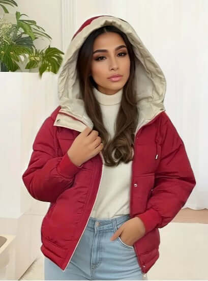 Plush fleece-lined women's hooded jacket, offering warmth and comfort in cold weather.