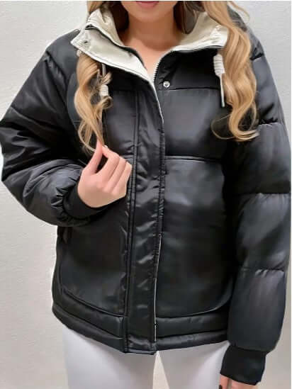 Stylish women's hooded jacket with soft fleece lining, ideal for cold weather & casual wear.