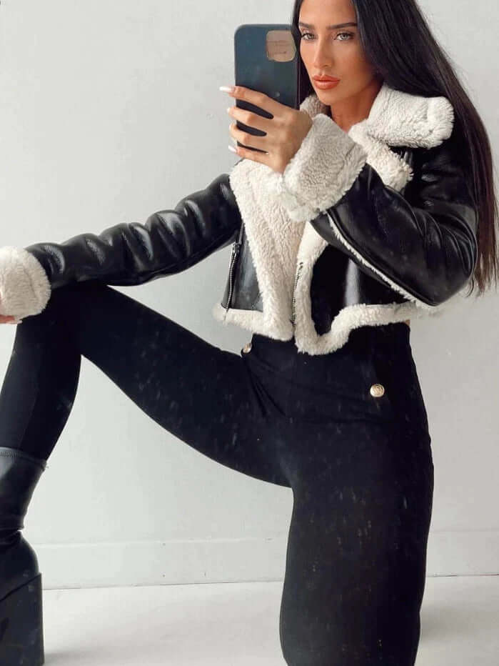 Stylish women's short fleece jacket, ideal for layered winter fashion. Cozy and warm casual outerwear.