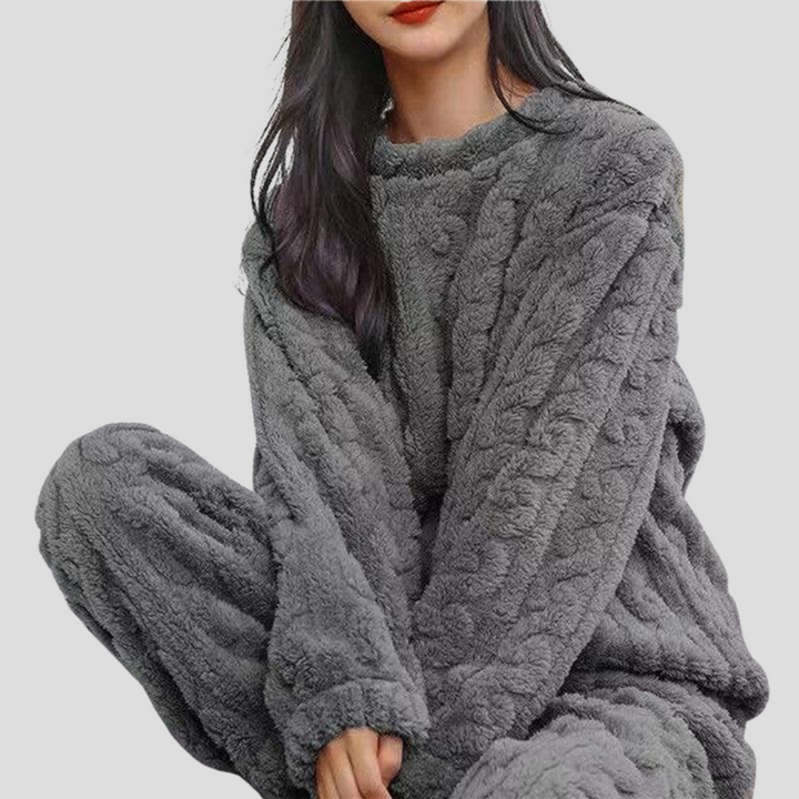 Stylish women's fleece pajama set for ultimate warmth. Soft loungewear, ideal for chilly winter nights at home.