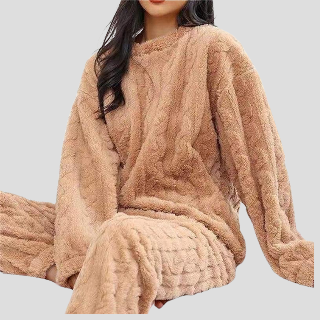 Ultra-soft women's fleece pajama set, designed for warmth and comfort during cold winter nights and relaxation.