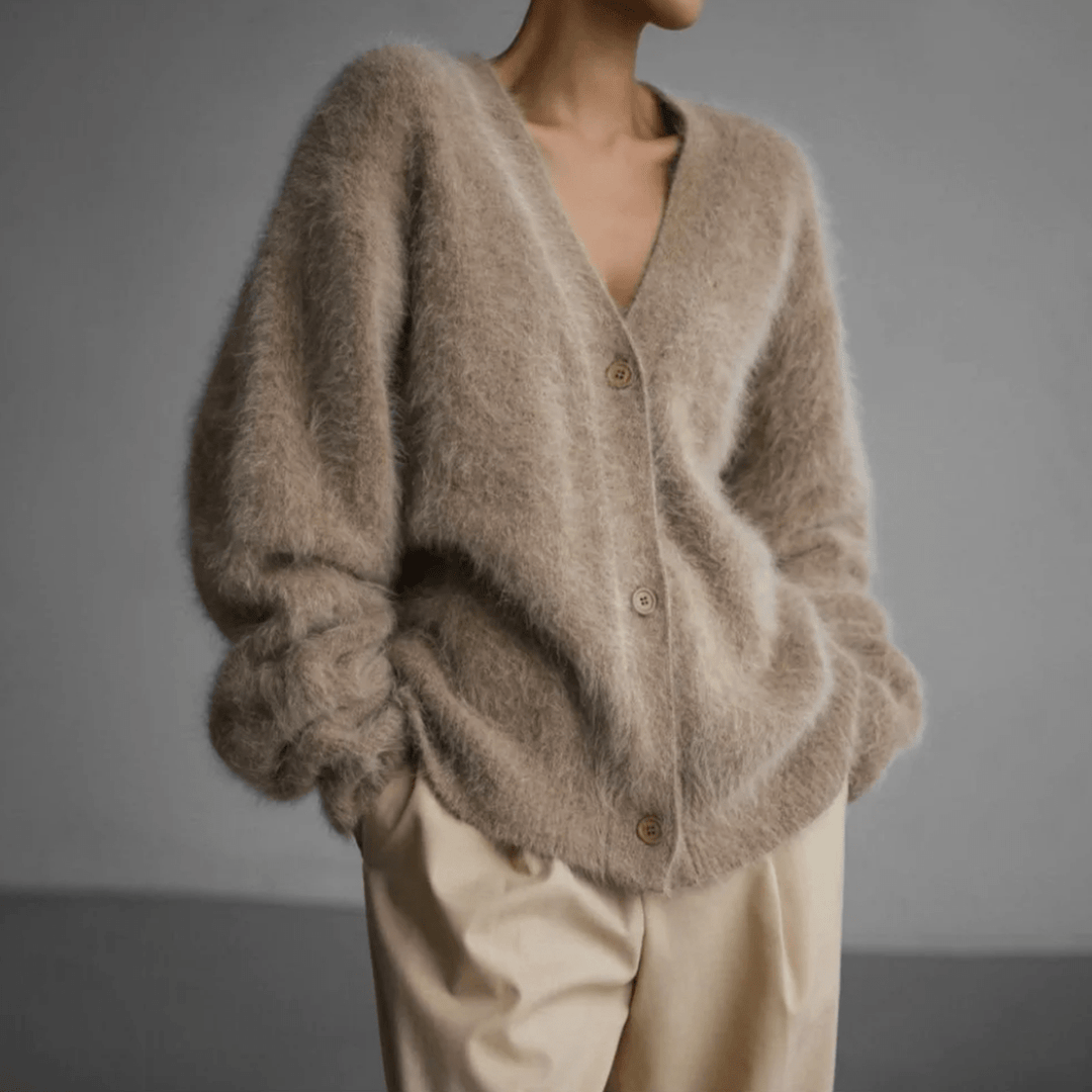 Stylish women's cozy knitwear cardigan, a relaxed fit fluffy sweater for cold weather.