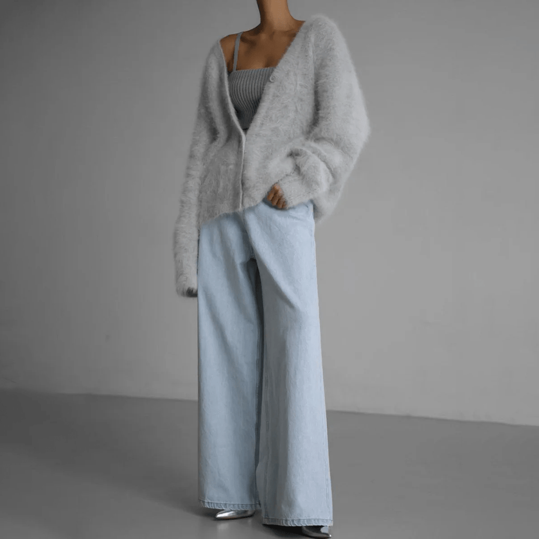 Comfortable women's knit cardigan, featuring a fluffy texture and relaxed fit for warmth.