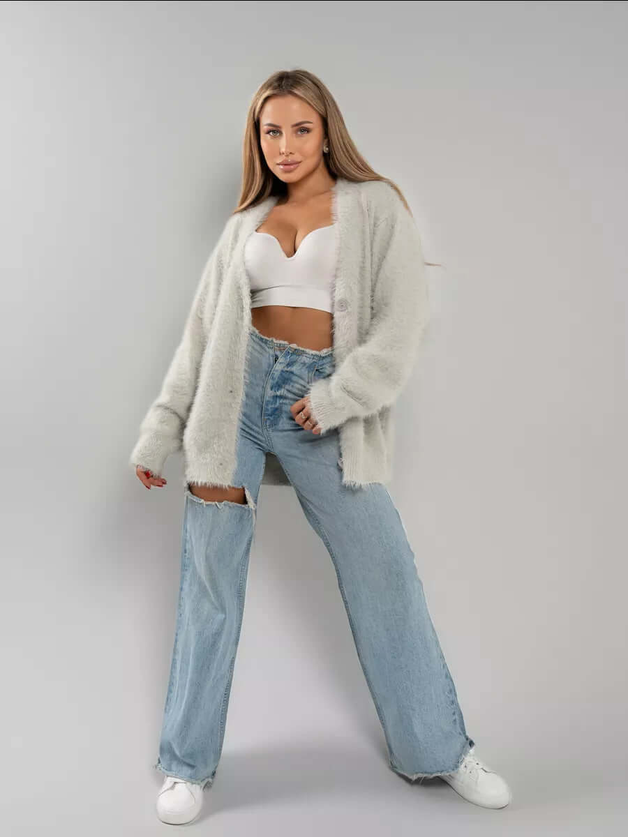 Woman wearing a cozy fluffy knit cardigan sweater casually, comfortable and warm winter fashion.