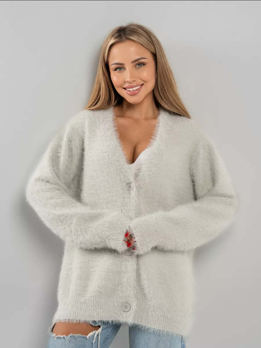 Back view of a women's long sleeve fluffy knit cardigan sweater, cozy and comfortable for winter.