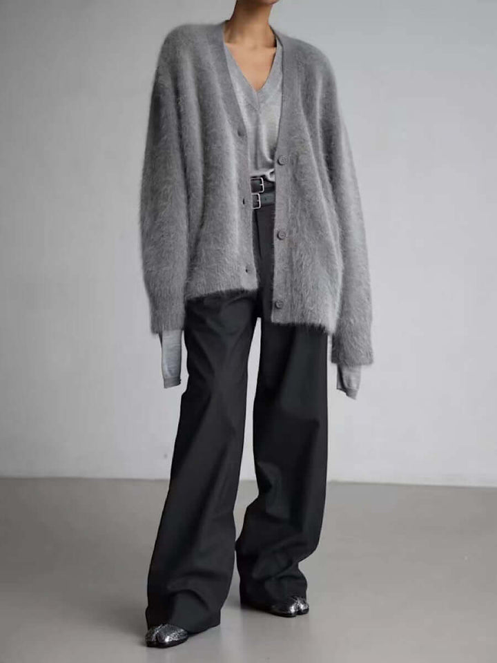 Neatly folded women's cozy fluffy knit cardigan sweater, soft knit and warm for winter comfort.