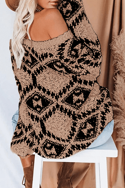 Modern women's geometric knit top. V-neck long-sleeve sweater, cozy and fashionable for cold seasons.