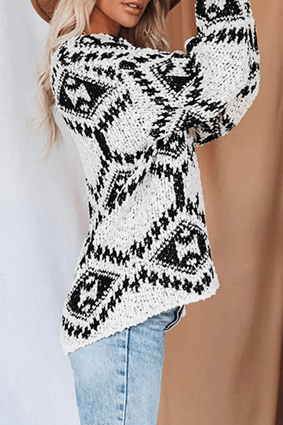 Autumnal women's V-neck geometric knit sweater. Stylish long-sleeve top, perfect for cozy layering.