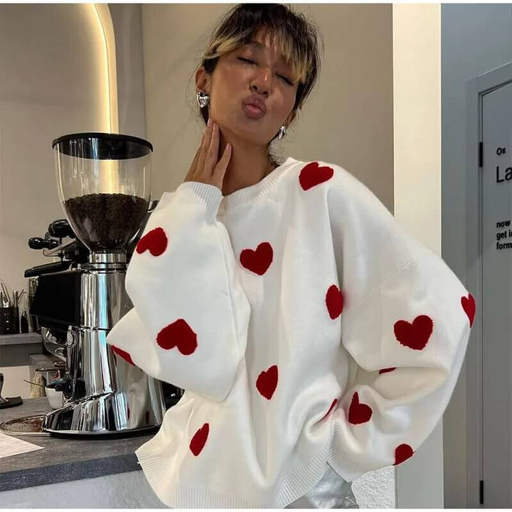 Women's cozy heart print loose fit sweater for casual fall and winter style.