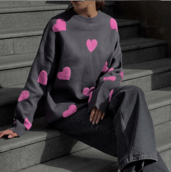 Women's casual heart print sweater, a cozy loose fit knit ideal for comfortable fall and winter fashion.