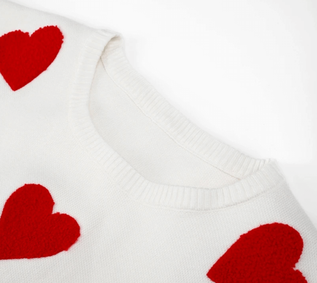 Romantic heart print women's oversized sweater, a cozy loose fit long sleeve top for relaxed everyday wear.