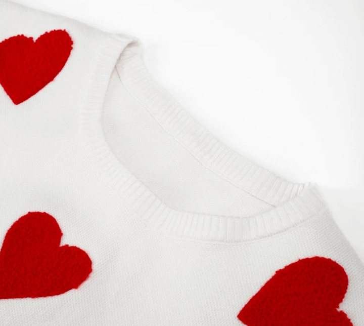 Romantic heart print women's oversized sweater, a cozy loose fit long sleeve top for relaxed everyday wear.