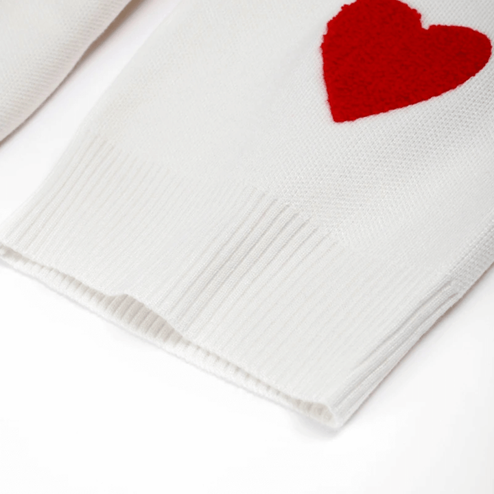 Oversized women's cozy sweater with delicate heart print, offering a relaxed and comfortable casual style.