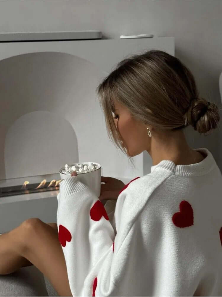 Charming heart print women's long sleeve sweater, a cozy knit top with a loose fit for winter comfort.