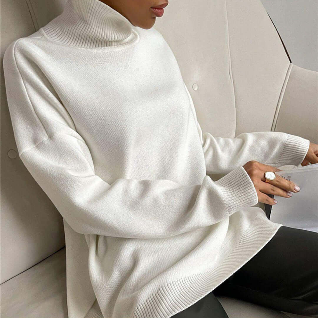 Detail shot of the fabric on a women's high-neck sweater, soft & warm knit essential.