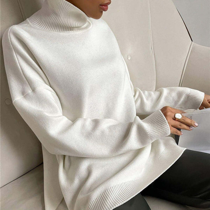 Detail shot of the fabric on a women's high-neck sweater, soft & warm knit essential.
