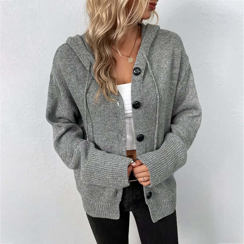 Trendy women's hooded knitted sweater, offering cozy style for everyday apparel.