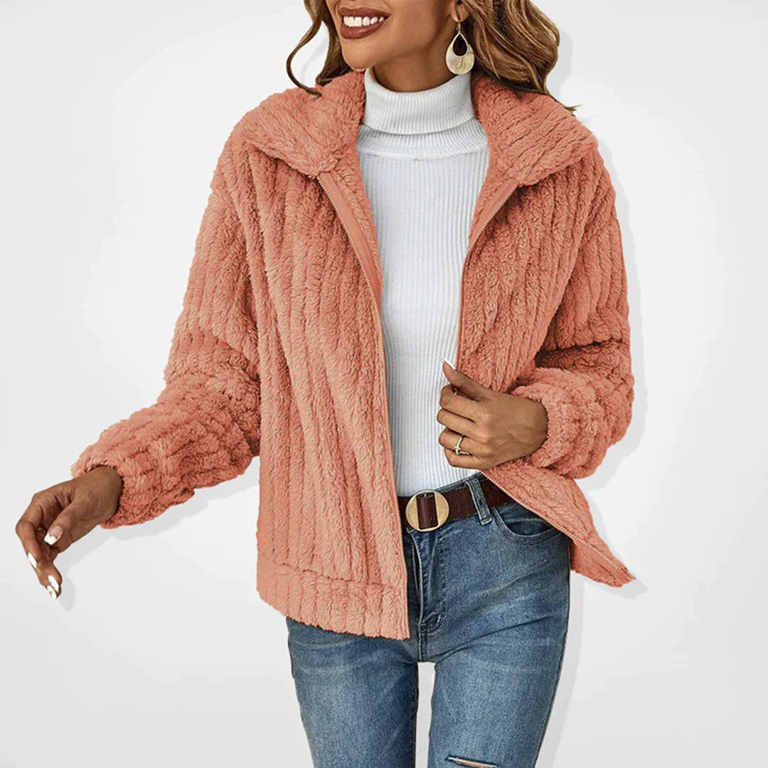 Stylish pink women's insulated fleece vest, offering cozy warmth and chic layering for chilly days.