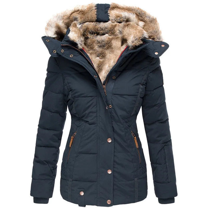 Women's cozy insulated winter puffer jacket, perfect for cold weather. Warm, stylish outerwear with a quilted design.