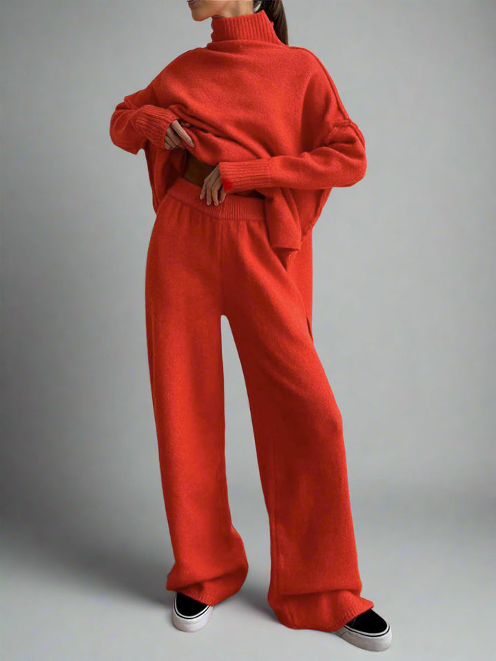 Chic women's knit lounge set: high-neck turtleneck pullover and matching wide-leg trousers for cozy comfort.