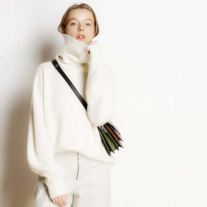 Soft long-sleeve women's turtleneck sweater, a comfortable knit essential for chilly winter days.