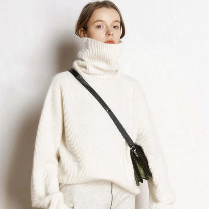 Chic women's knit turtleneck sweater, providing warmth and a fashionable look for winter apparel.