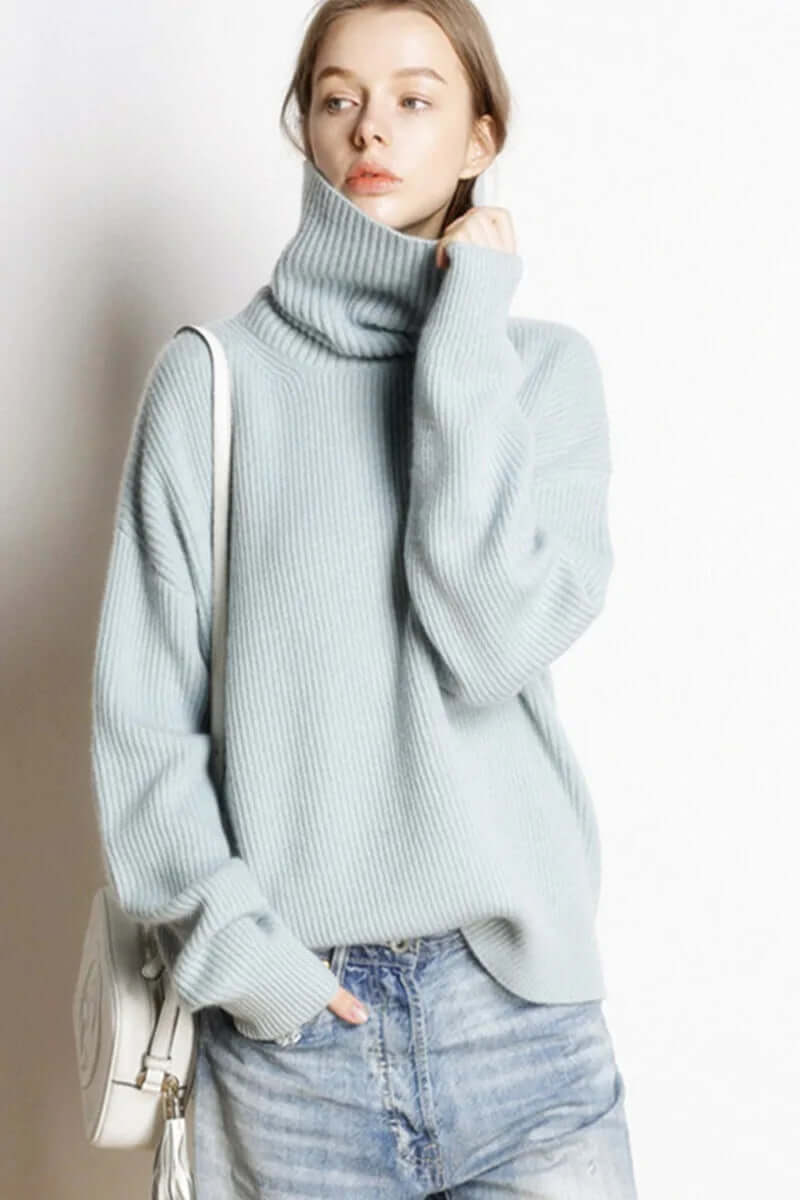 Fashionable women's winter knit turtleneck sweater, a versatile and warm apparel piece.