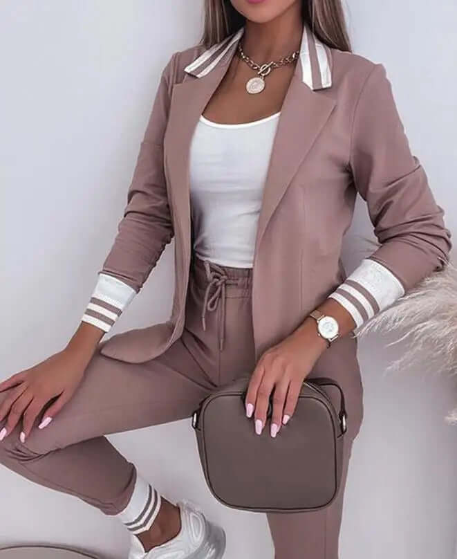 Women's cozy knitted 2-piece lounge set. Relaxed fit sweater and wide leg pants for comfortable fall/winter style.