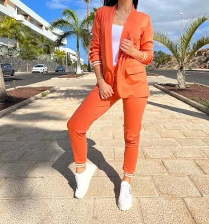 Full view of a women's cozy knitted lounge set, featuring a relaxed fit sweater and wide leg pants for comfortable styling.