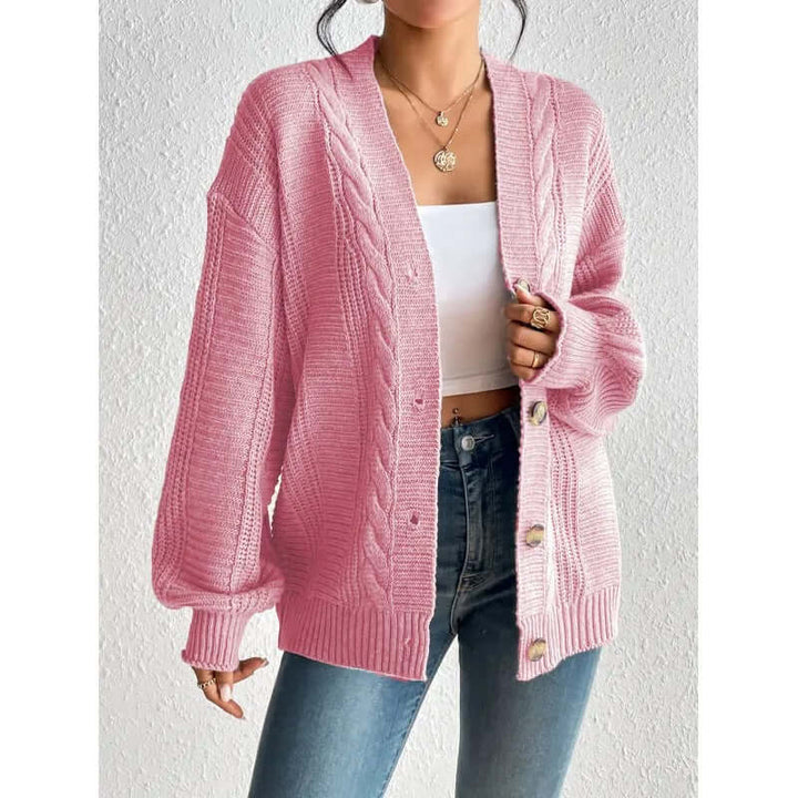 Close-up of a women's cozy knitted cardigan sweater, highlighting warm texture and stylish design.
