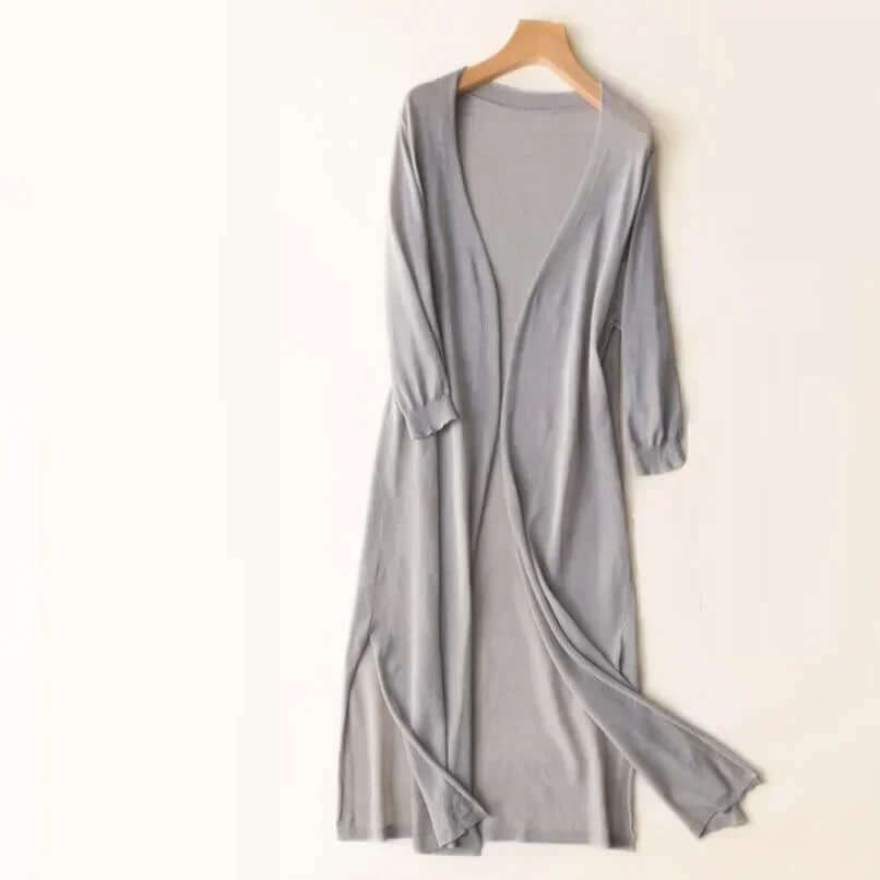 Comfortable women's long knitted sweater, versatile for all seasons and chic layering.