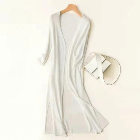 Women's knitted long cardigan in a cozy style, perfect for elegant and comfortable layering.