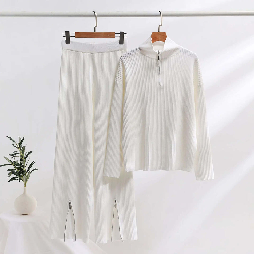 Chic women's knitted loungewear set in black. Stylish wide-leg pants & cozy sweater, perfect for fall/winter fashion.