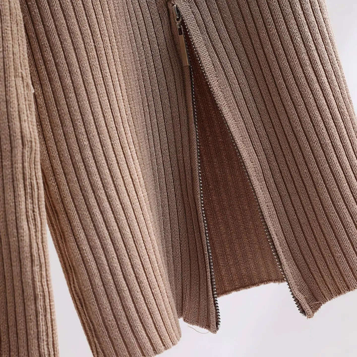 Close-up of a white women's knitted loungewear set, showcasing the cozy texture of the knit sweater and wide-leg pants.