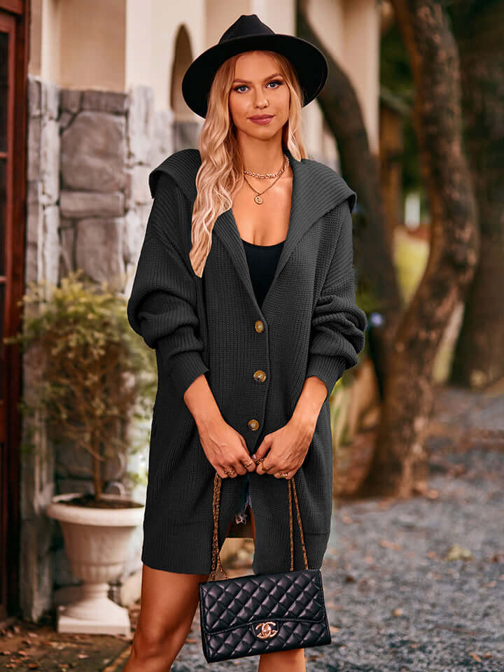 Black women's knitted midi cardigan, an elegant acrylic outerwear for versatile layering.