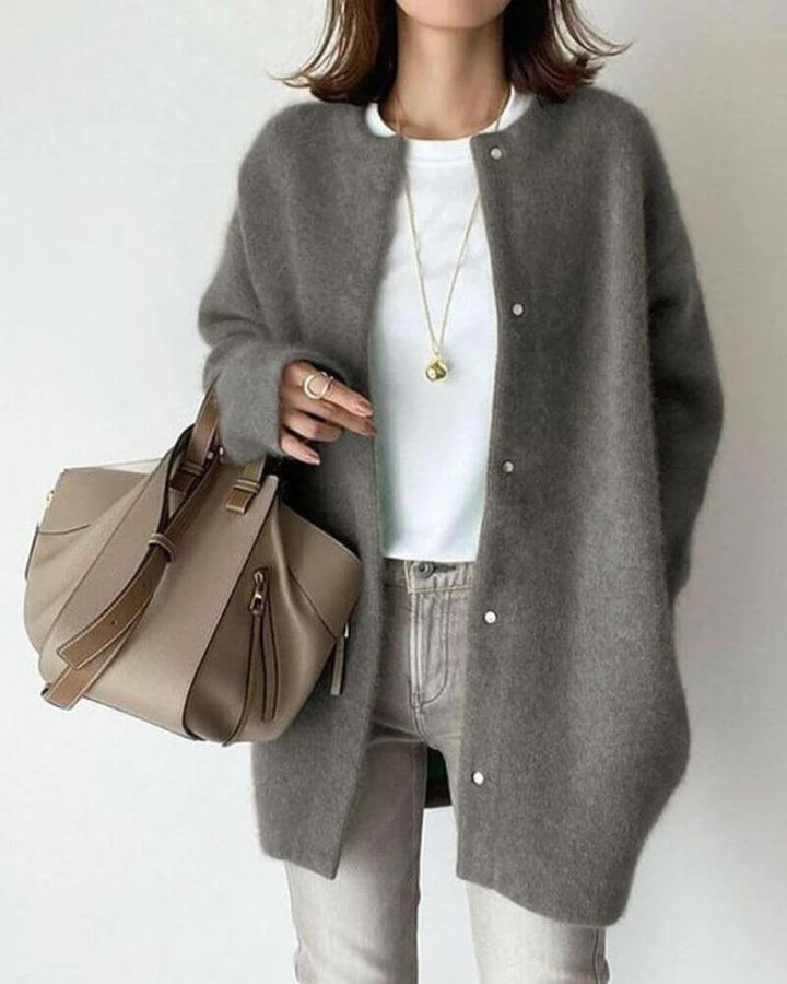 Women's cozy knitted open-front cardigan in soft, warm yarn. Perfect stylish comfort sweater for cool weather.