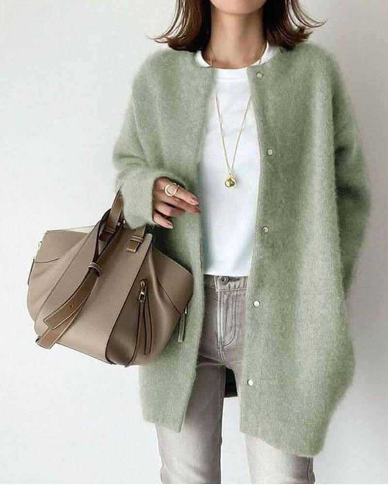 Woman wearing a stylish long-sleeve knitted cardigan, an essential cozy open-front sweater for everyday comfort.
